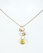 Complete your outfit with this elegant gold-tone necklace. Small gold jewels hang off each circle link. A unique and delicate piece.