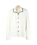 This viscose nylon long sleeve full needle knit jacket is flattering and beautifully shaped. Dry clean or hand wash color and lay flat to dry. Steam or press with steam to maintain the great texture of the knit jacket.

DISPLAY PICTURE COLOR: WHITE W/ BLACK PIPING