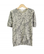 Compositions' silk cotton cashmere short sleeve jewel neck sweater is a beautifully designed fine knt top that is ideal for the fall and winter seasons. The tone-on-tone floral prints sweater gives a suble and an elegant look. The gradation of the colors allow you to have the sweater to match many gray or black jackets, skirts and pants that you might already have. You'll love this short sleeve top for its floral prints and luxurious look and feel. This item works nicely with our matching floral cardigan and floral knit jacket. Hand-wash or dry clean for best results.

Available in 2 colors: Black prints and Gray prints.

DISPLAY PICTURE COLOR: GRAY 
