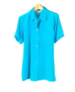 Washable crepe-de-chine silk short sleeve camp shirt has side slits and one pocket. This silk shirt is softly shaped, light weight, and loose-fitting. It is incredibly versatile. The camp shirt can easily match the sleeveless shell, trousers, and skirts in this group collection. Machine wash or dry clean.

The short sleeve camp shirt length: 28