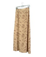 This medium weight washable 100% silk crepe-de-chine long skirt with prints in chestnut brown shade is perfect for early fall and beyond.  Back waist has partial elastic for easy fit.  It is as comfortable in the office and meetings as it is out for dinner, party and travel.  The prints can work well with fall colors in chestnut, oatmeal and warm taupe shades.  This feminine soft skirt with prints can matche the chestnut solid color jackets and shirts in this group.  Handwash cold and hang to dry; or dry clean. 

Long skirt length: 33"-35" long.

DISPLAY PICTURE COLOR: BROWN PRINT