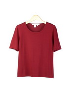 This women's high twist silk/lycra jewel neck short sleeve sweater is made in a smooth flat knit. This top works nicely as a layering piece, and has an available matching cardigan and skirt that make a beautiful outfit. This high-quality sweater is wrinkle resistant, so it is easy-fit and easy-care. Mid-hip length. Hand-wash or dry clean to maintain soft texture.
