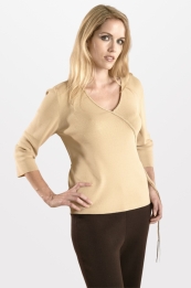 This stretch viscose nylon wrap-style pullover is 65% viscose and 35% nylon in fine 12 gauge full-needle knit. Its braided design gives it a classic look. This pullover is washable, so it is easy-care as well as easy-fit. It drapes very nicely, giving a luxurious look. This top has matching knit pants to make great sets.

Available in 6 colors: Black, Light Coral, Mango Sorbet, Pool, Sky, and White. 

DISPLAY PICTURE COLOR: SKY